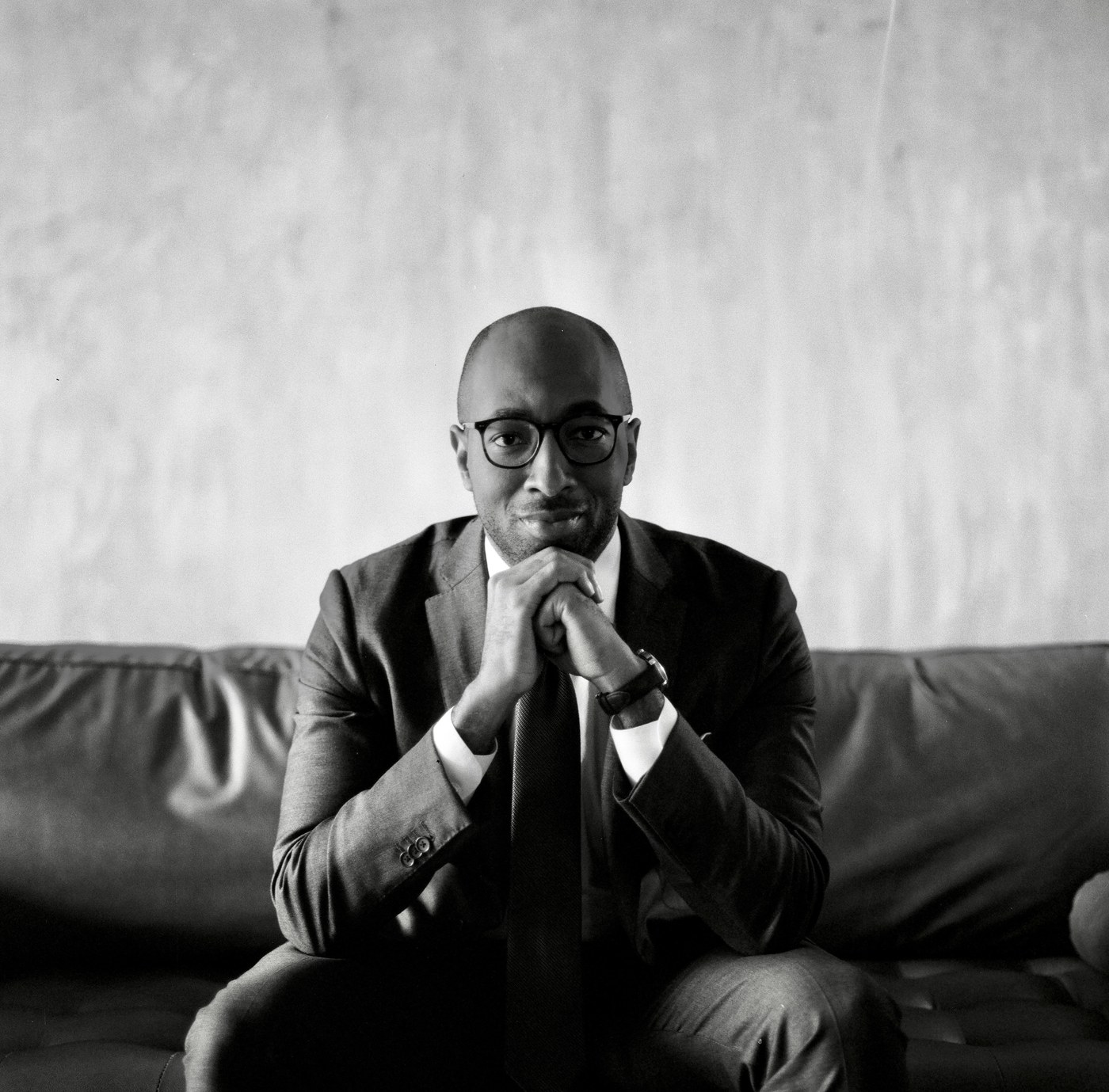 Christian Mitchell, hands folded, photographed on medium format black and white film