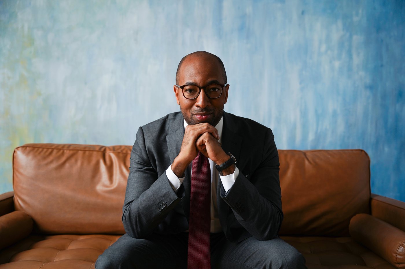 Cover portrait against a painted blue backdrop
